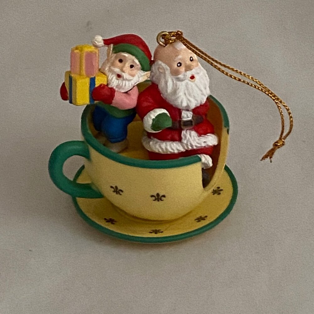Vintage Ornament Santa clauses sitting in Disneyland Mad -Tea-party